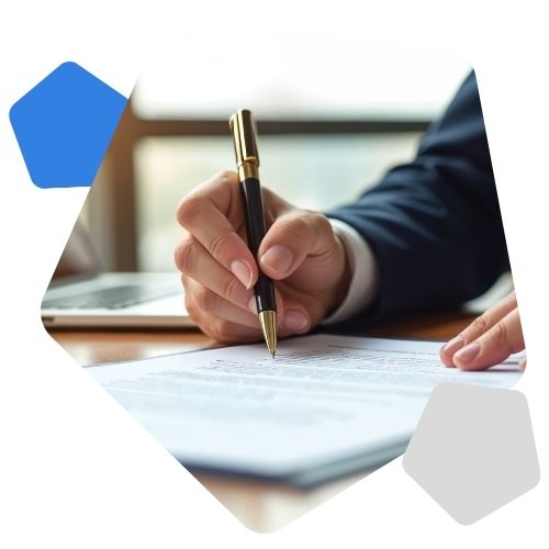 Man in suit signing paper